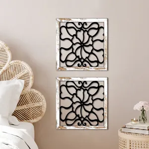Wooden hollow wall decor with distressed white frame and black floral pattern for living room.