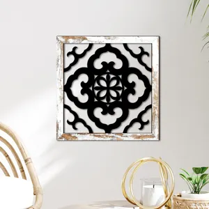 Detailed view of the rustic wooden wall decor featuring black cutout geometric patterns.