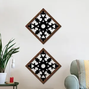 Wooden hollow wall art detail, diamond frame with black floral pattern, elegant home decor.