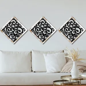 Diamond wood wall art detail, modern living room decor, scrollwork hollow pattern hanging panel.