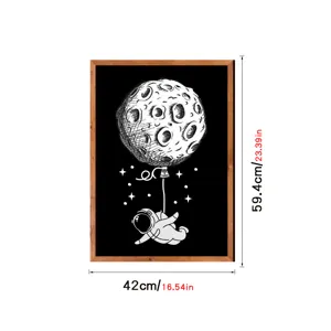 Nordic style wooden framed wall art featuring a creative astronaut moon balloon illustration print.