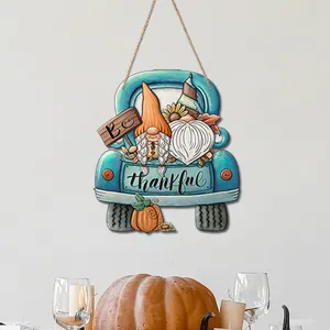 Thanksgiving wooden truck sign detail, gnome and pumpkin decor for autumn home party wall hanging.