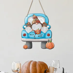 Detailed view of the autumn blue truck wooden hanging sign with cute gnomes and pumpkins.
