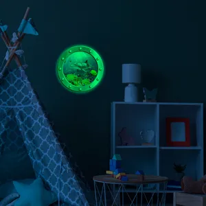 Luminous porthole wall sticker featuring marine animals glowing in the dark for home decor.