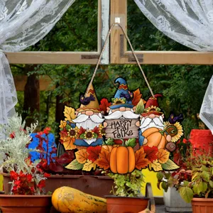 Autumn gnome hanging sign detail shot, rustic wooden Thanksgiving decor with pumpkins and sunflowers.