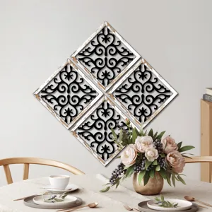 Close-up scene of wooden hollow wall art panels hanging above a dining table with flowers.