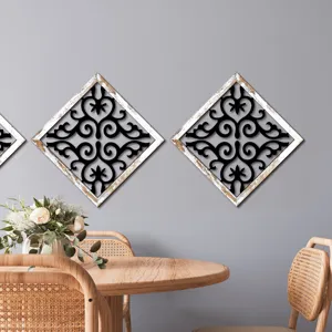 Wooden hollow wall decor set with distressed frame and black scrollwork for home living room.