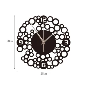 Detail view of black decorative wall clock with hollow bubble circles and 28cm size.
