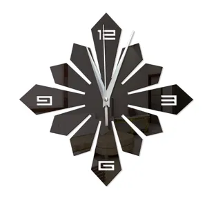 Modern creative mirror wall clock detail showing unique starburst geometric design and hands.