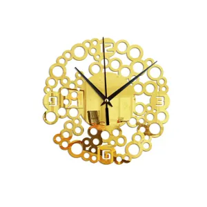 Gold acrylic mirror wall clock, creative abstract circle design for modern home decor.