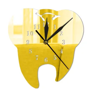 Close-up detail of the tooth-shaped mirror wall clock with black hands and numbers.