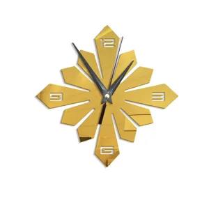 Golden decorative acrylic wall clock with creative sunburst design and black hands for home decor.