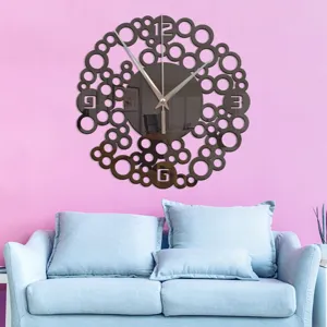 Creative mirror wall clock with abstract circles design for modern living room decor.