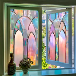 Detail shot of colorful iridescent window film applied to glass, creating a stained glass effect.