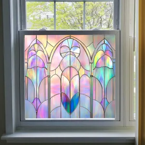 Close-up detail of colorful window film on glass, showing stained glass design and beautiful light effects.