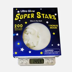 Glow in the dark stars and moon set boxed detail showing net weight on digital scale.