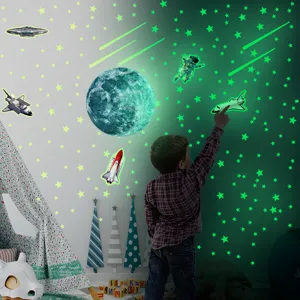 Glow in the dark space wall stickers set, stars, moon, and astronaut for kids bedroom decor.