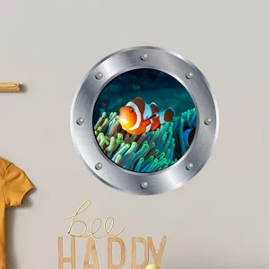 Detail view of luminous porthole wall sticker featuring clownfish design for kids room decor.