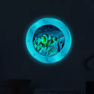 Detail view of luminous porthole wall sticker with clownfish pattern for kids room decor.