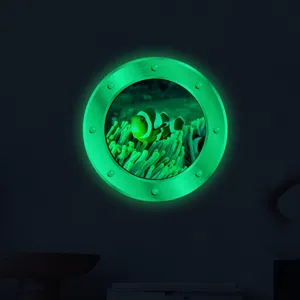 Glow-in-the-dark luminous porthole wall sticker, underwater clownfish kids room decor.