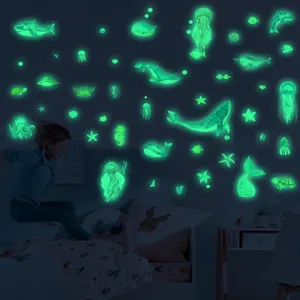Detail view of glow in the dark ocean animals wall stickers for kids bedroom decor.