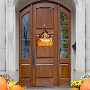 Detailed view of the Thanksgiving turkey wooden hanging sign with pumpkins on a rustic wooden door.