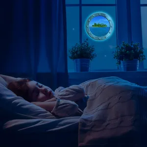 Luminous porthole wall sticker scene detail, glowing ocean view decoration for bedroom at night.