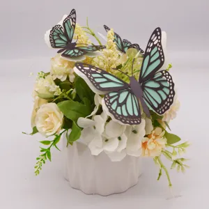 Kunstbloem potplant met 3D uitgeholde papiervlinders, elegante huisdecoratie detailweergave.