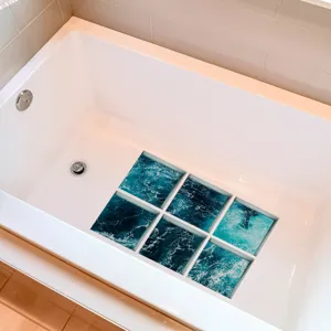 Anti-slip bathtub stickers with ocean wave pattern showing the bathroom tub usage detail.