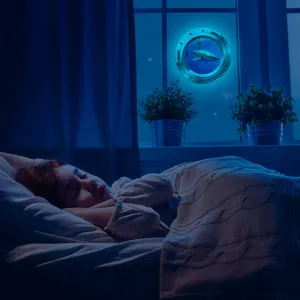 Luminous porthole wall sticker featuring a shark design, glowing in the dark for bedroom decor.
