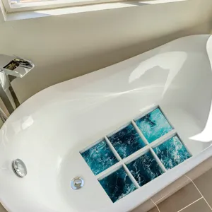 Detailed view of ocean wave pattern non-slip bathtub stickers for bathroom safety use.