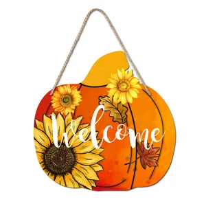 Fall pumpkin wooden welcome sign with sunflowers and maple leaves for autumn holiday porch decor.