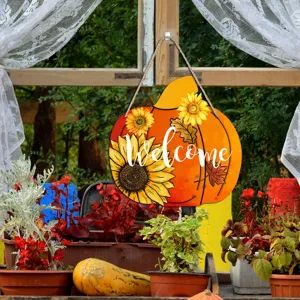 Detailed view of autumn pumpkin wooden hanging sign with sunflower decor for porch and party decor.
