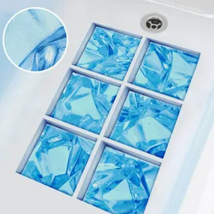 Close-up of blue frosted anti-slip bathtub stickers showing textured surface detail.