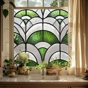 Decorative PVC window film featuring a green and white geometric fan design for privacy.