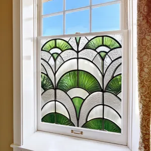 Decorative window film with green and white geometric fan pattern for home decor detail.