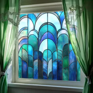 Blue stained glass window film detail showing arched pattern design on home window glass.