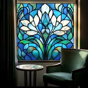 Detail of blue and green floral stained glass window film showing exquisite translucent artistic pattern.
