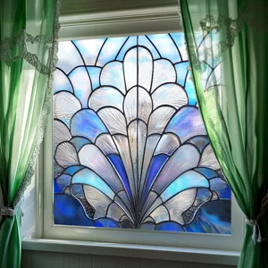 Detailed view of decorative static window film with blue stained glass fan pattern on glass.