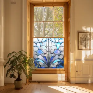 Detailed view of the decorative stained glass window film installed on a sunny room window.