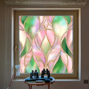 Colorful static window film detail showing vibrant stained glass pattern on room window glass.