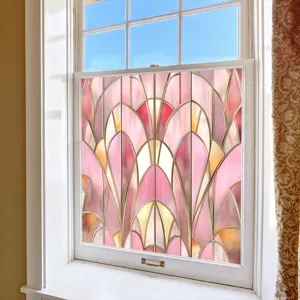 Detailed close-up view of decorative pink stained glass window film texture on home glass.