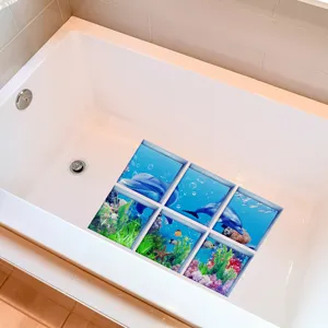 Detailed view of anti-slip bathtub stickers with dolphin coral design inside clean white tub.