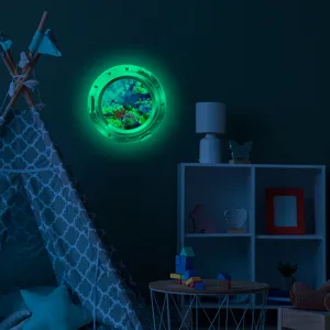 Luminous ocean porthole wall sticker for kids room decor, glowing underwater scene.