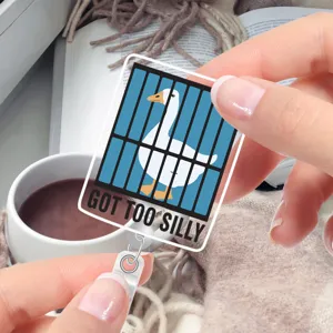 Close-up detail of the funny silly goose retractable badge reel, cute office ID holder design.