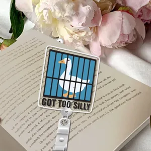 Acrylic silly goose badge reel detail shot, cute cartoon design with metal clip and reel.