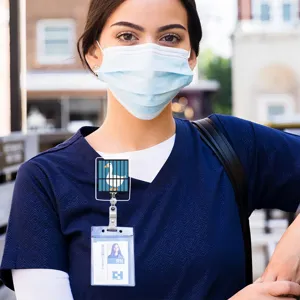 Detailed shot of cute silly goose badge reel and ID card holder worn on medical scrubs.