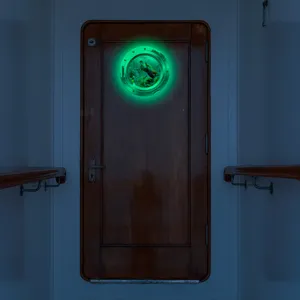 Glow in the dark porthole wall sticker with marine animal turtle design for home decor detail.