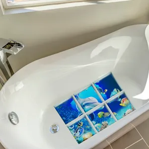 Non-slip bathtub sticker with ocean dolphin print, matte textured safety bath mat detail.
