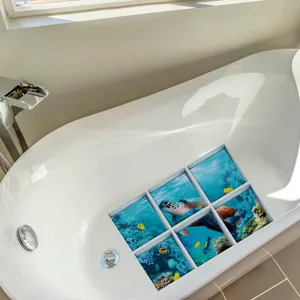 Detailed view of anti-slip bathtub stickers featuring vibrant ocean turtle and coral designs.